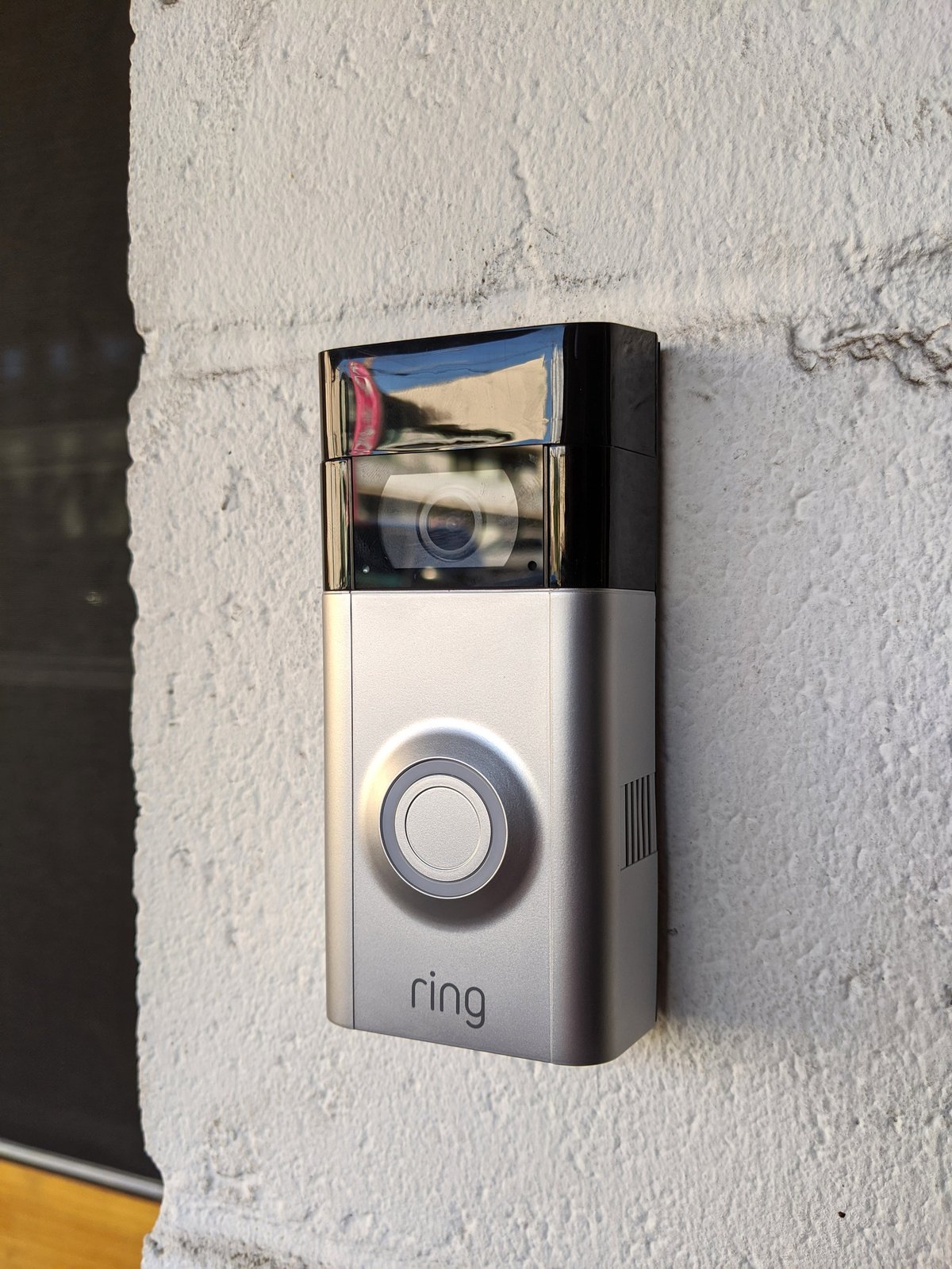 Ring Doorbell 2 mounted on building entrance, smart video doorbell security camera