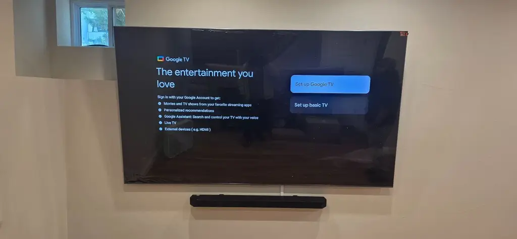 Professionally wall mounted Google TV with a matching soundbar mounted directly below