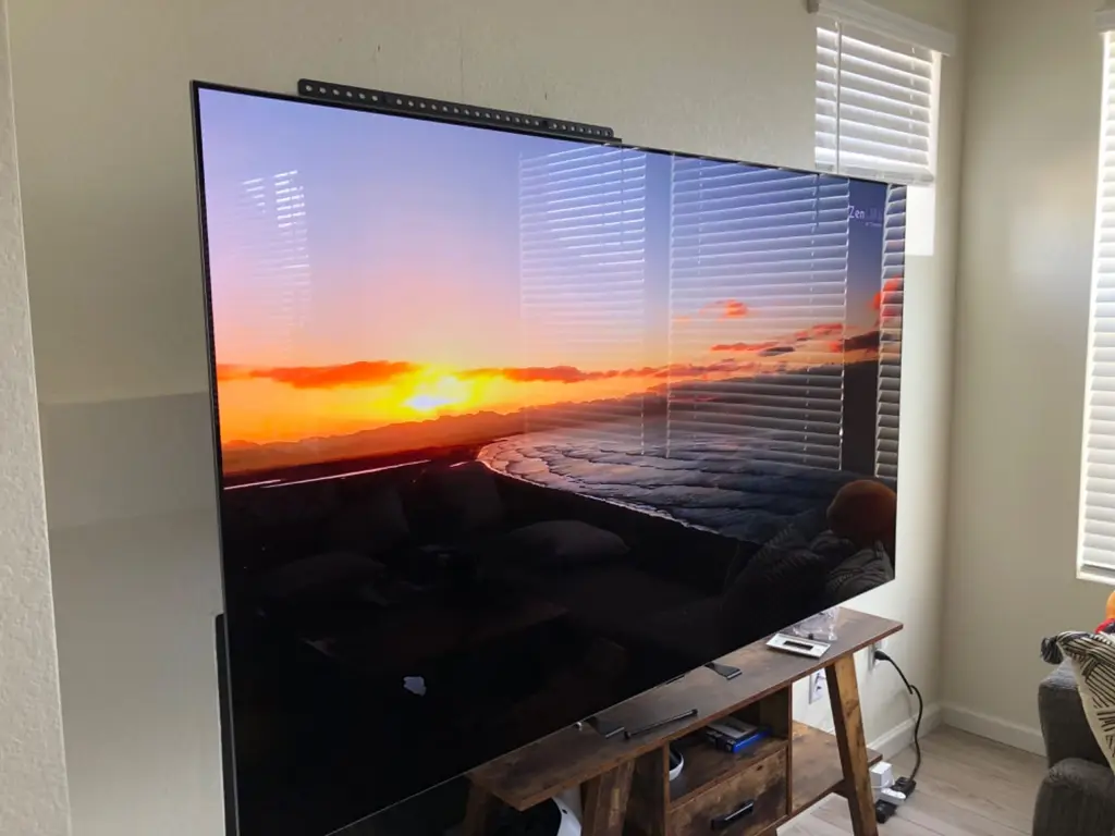 Extra large TV installed for a living room home theater setup