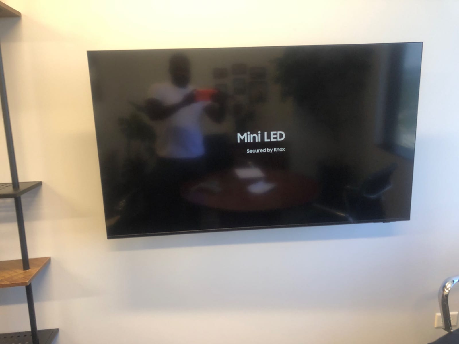 Large TV wall mounted in a living room