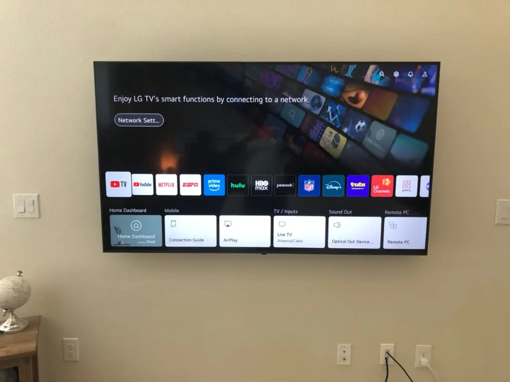LG smart TV wall mounted in a Littleton living room