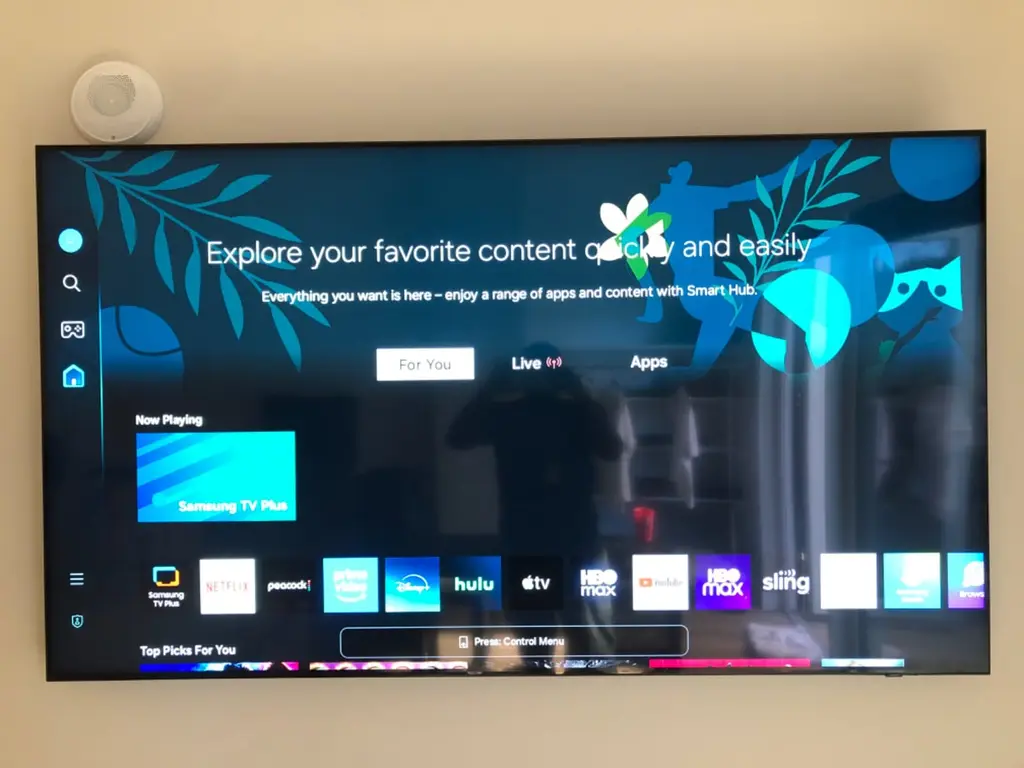 Large Samsung smart TV wall mounted with a low-profile bracket