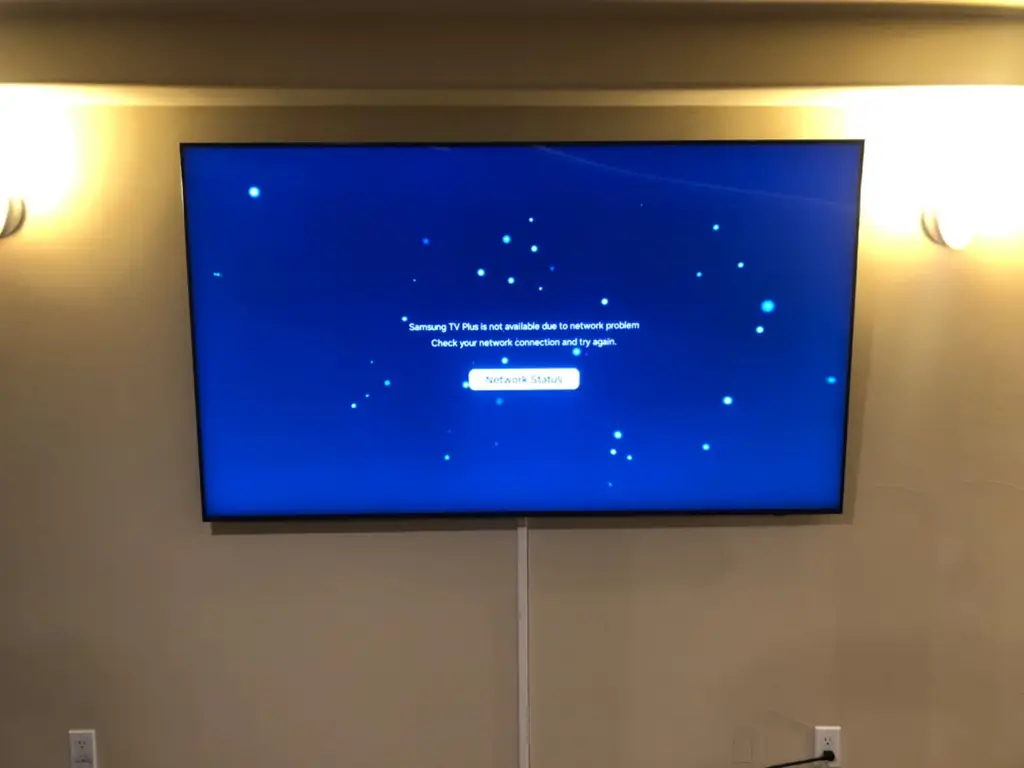 Samsung TV wall mounted in a warmly lit living room in Loveland