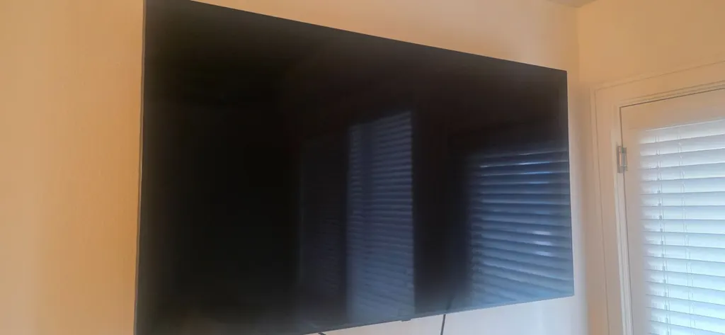 Large TV mounted on a living room wall