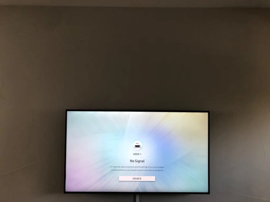TV mounted on a dark accent wall