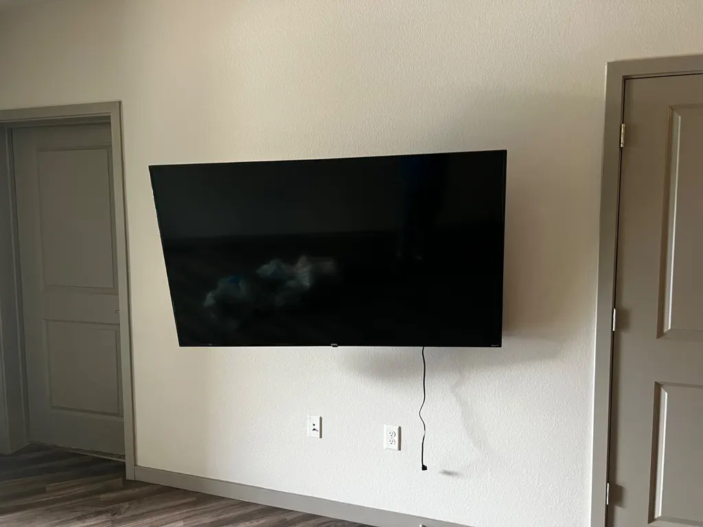 Wall-mounted TV in a bright living room