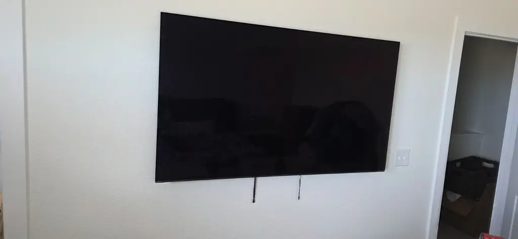 TV flush mounted on a white wall in Westminster