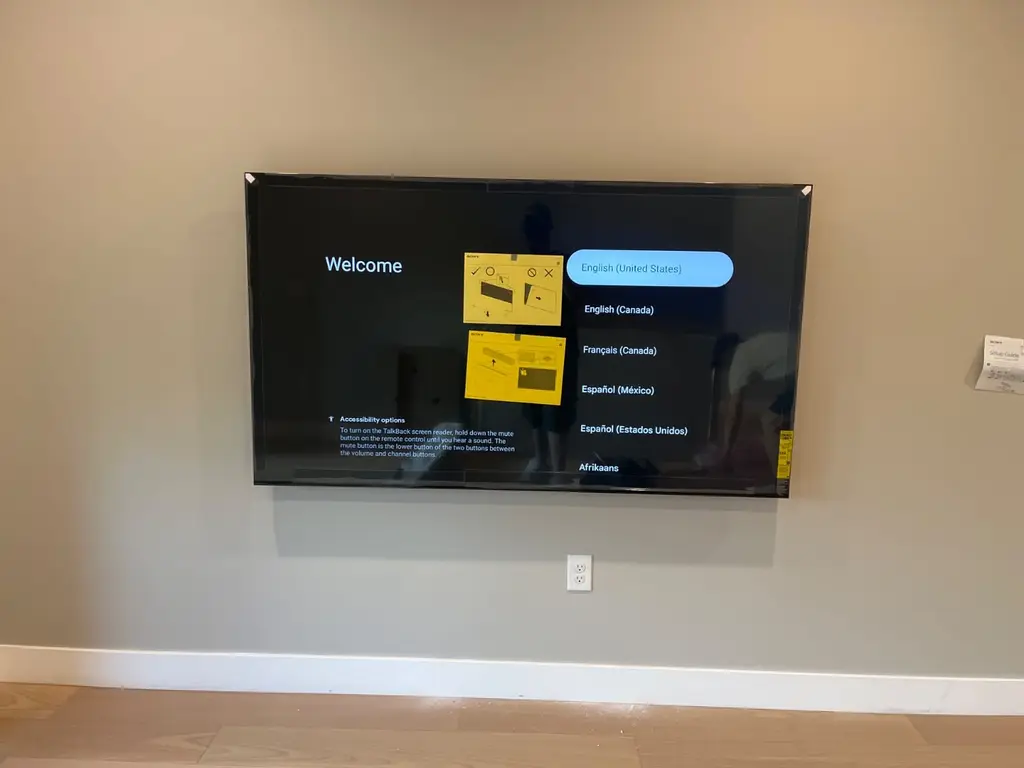 TV mounted level on a clean living room wall during new TV setup