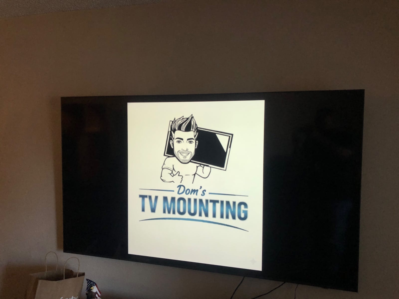 Wall-mounted TV with a soundbar installed below it