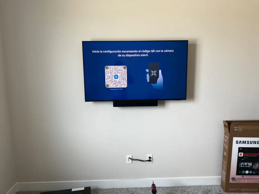 TV and soundbar mounted on a living room wall in Littleton, CO