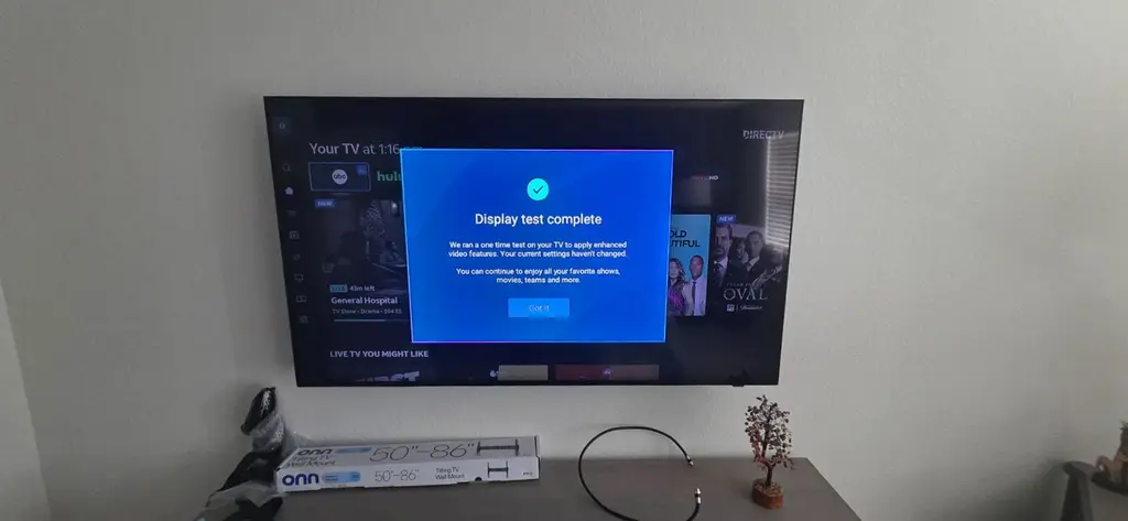 Wall-mounted TV with a soundbar installed below it