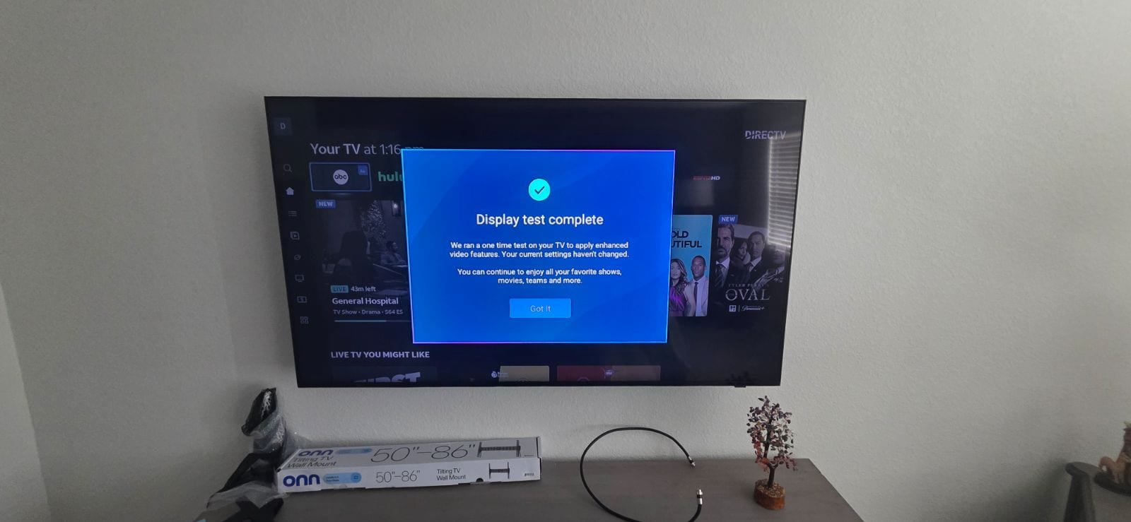 Wall-mounted TV with a soundbar installed below it